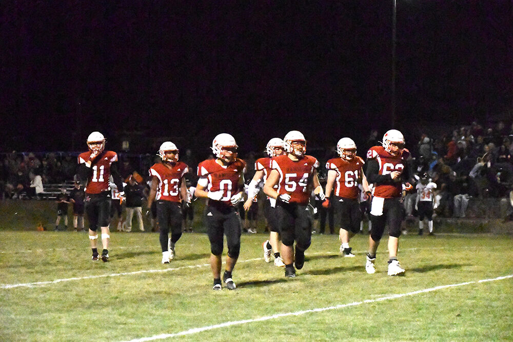 The Dufur football team runs out on to the field vs Imbler Oct. 3